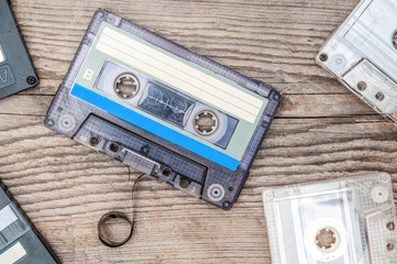 Used audio cassettes on grunge wooden background