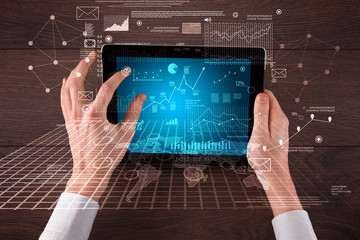 Business hands holding tablet