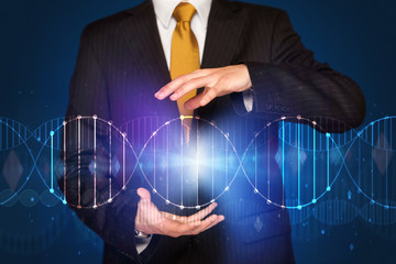 Businessman holding DNA