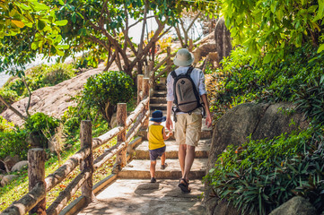 Father and son travelers at the Hon Chong cape, Garden stone, popular tourist destinations at Nha...