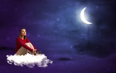 Fototapeta na wymiar Woman sitting on cloud