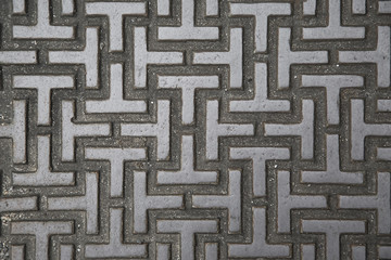 Texture of the metal manhole cover of street sewage shaft