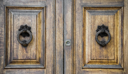 Details of an old wooden door in Florence,Tuscany, Italy.