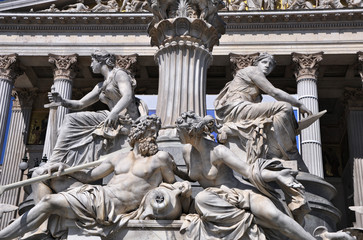 Fragments of the Pallas Athena (goddess of wisdom) fountain, in front of the Austrian Parliament Building. The figures symbolize the rivers Danube, Inn, Elbe and Moldau. Vienna, Austria, Europe.