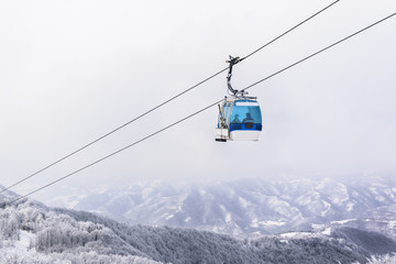 Gondola ski lift in mountains © disq