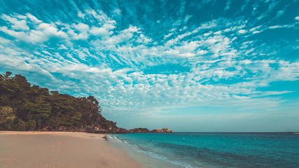Stunning sea sand beach and cloud blue sky scenery background. (vintage style)