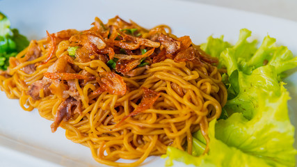 Delicious stir-fried yellow noodles with duck recipe. (vintage style)
