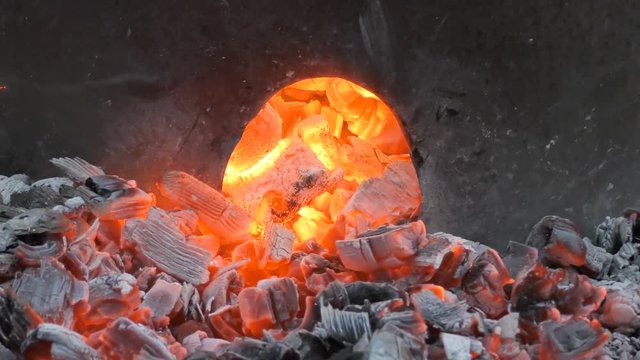 4K Footage Of Red Hot Embers At The Foot Of A Trash Can