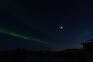 Northern lights in iceland  with moon and jeep