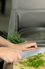 Chef training cut vegetable on cutting board with knife japan