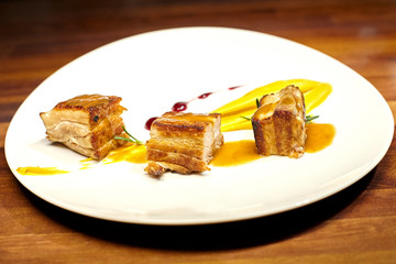 Pork meat with sweet potato puree and superfoods sauce.