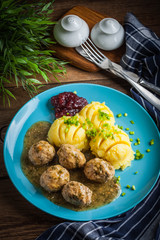Meatballs with potatoes in dill sauce.