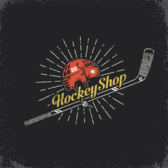 Fototapeta premium Retro logo for the hockey shop - stick, helmet and inscription. Layered vector illustration - grunge texture, text, background separately and can be easily disabled.