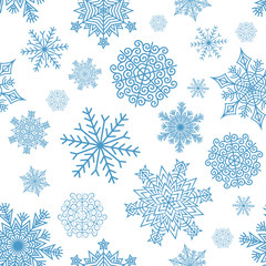 Seamless pattern of intricate blue snowflakes on a white background. Included in swathes panel.