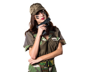 Military girl holding a pistol