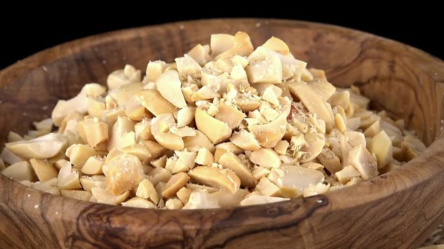 Portion of rotating minced Peanuts as seamless loopable 4K UHD footage