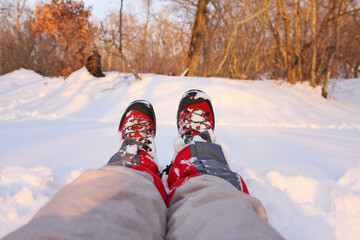 Mountaineer resting in a snowy forest