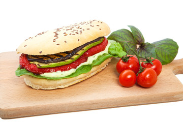 The sandwich with vegetables.