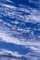 Blue summer sky with light white clouds. Background 01.