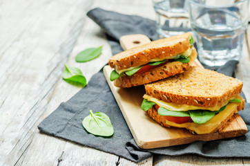 Spinach tomato cheese grilled rye sandwiches