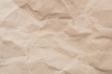 Recycled crumpled light brown paper texture or paper background