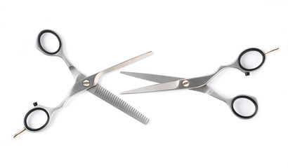 Two professional haircutting scissors isolated on white, with clipping path.