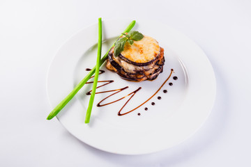 Roasted slices of eggplant baked with tomato, Grana Padano cheese, mozzarella and basil