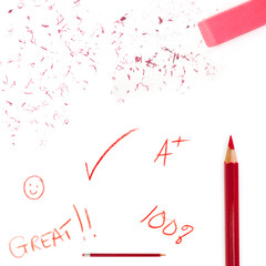 Teacher's red pencil markings with eraser and bits