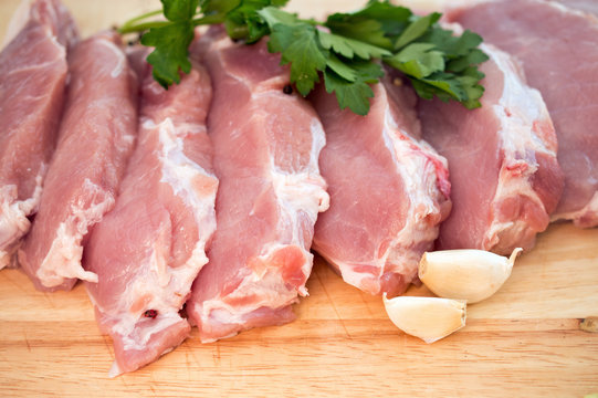 sliced meat with garlic and parsley
