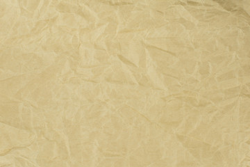 Recycled crumpled light brown paper texture or paper background