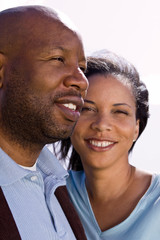 Happy African American couple laughing and smiling.
