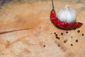 chilli and garlic on wooden background