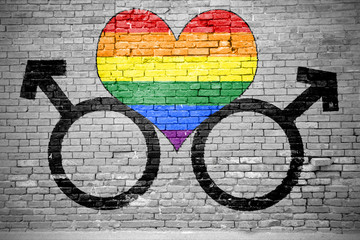 Ziegelsteinmauer mit Herz männlichen Symbolen Regenbogenfahne Graffiti