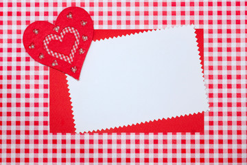 Valentine's Day.  8 March. Greeting card with a heart on a red plaid background