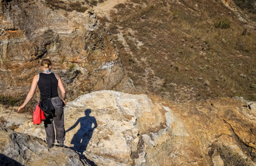 Woman trekking on rocky trail