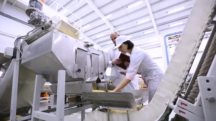 Checking the product quality on the macaroni factory - Powered by Adobe