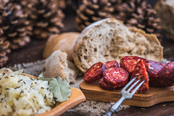 Farmer's Breakfast. Sausage, Sour Cabbage and Bread. Raw Ingredients.