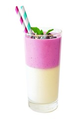 Layered blueberry and coconut smoothie with berries and mint isolated on white