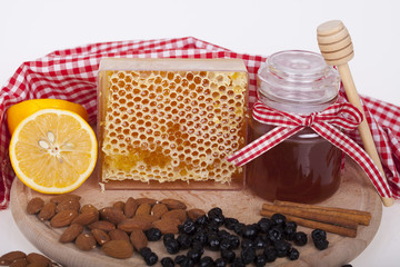 Honey in jar on a wooden background