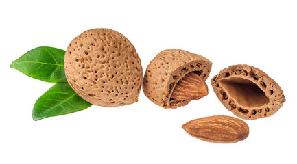 heap of almonds with  green leaf isolated on white background, m