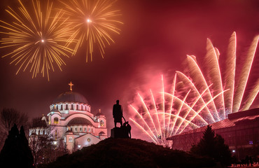 Belgrade, Serbia, Europe - January 14, 2017: Orthodox New years eve celebration with fireworks over the Church of Saint Sava at midnight in Belgrade, Serbia on January 14, 2017 - obrazy, fototapety, plakaty