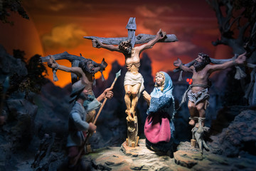 Handmade wooden statues representing the Crucifixion of jesus.