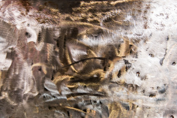 Background formed by a scratched sheet steel.