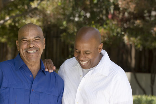 African American father and his adult son.