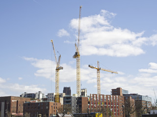 Liverpool city building construction with yellow cranes Britain, UK, England