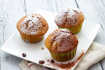 Muffins on a wooden table