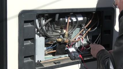 Technician Troubleshoots and Repairs RV Refrigerator