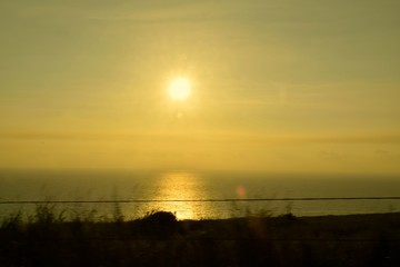 On the Road Sunrise / Sunrise during a drive on the southern shores of the Big Island, Hawaii.