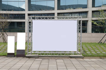 Large blank billboard on a street wall,  banners with room to add your own text