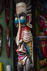 Obraz premium Colorful wooden masks and handicrafts on sale at shop in the Thamel District of Kathmandu, Nepal.